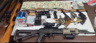 Two Arrested, Drugs, Guns, and Cash Seized in Floyd County Raid