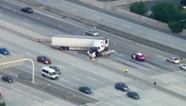 Semi Truck Crashes Through Divider on 118/405 Freeway Transition in Granada Hills, Lanes Shut Down